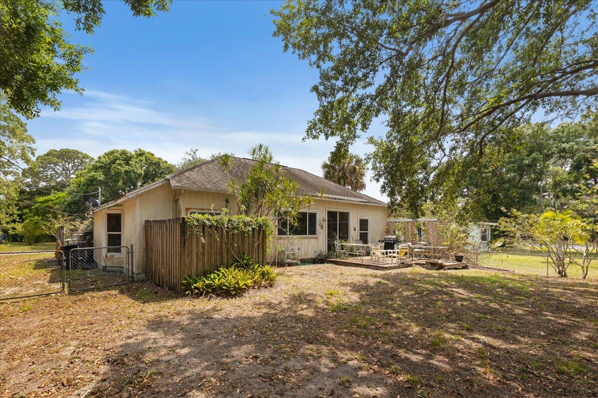 8006 Eden Road Fort Pierce, FL 34951 - Photo 21 of 25 a front view of a house with a yard