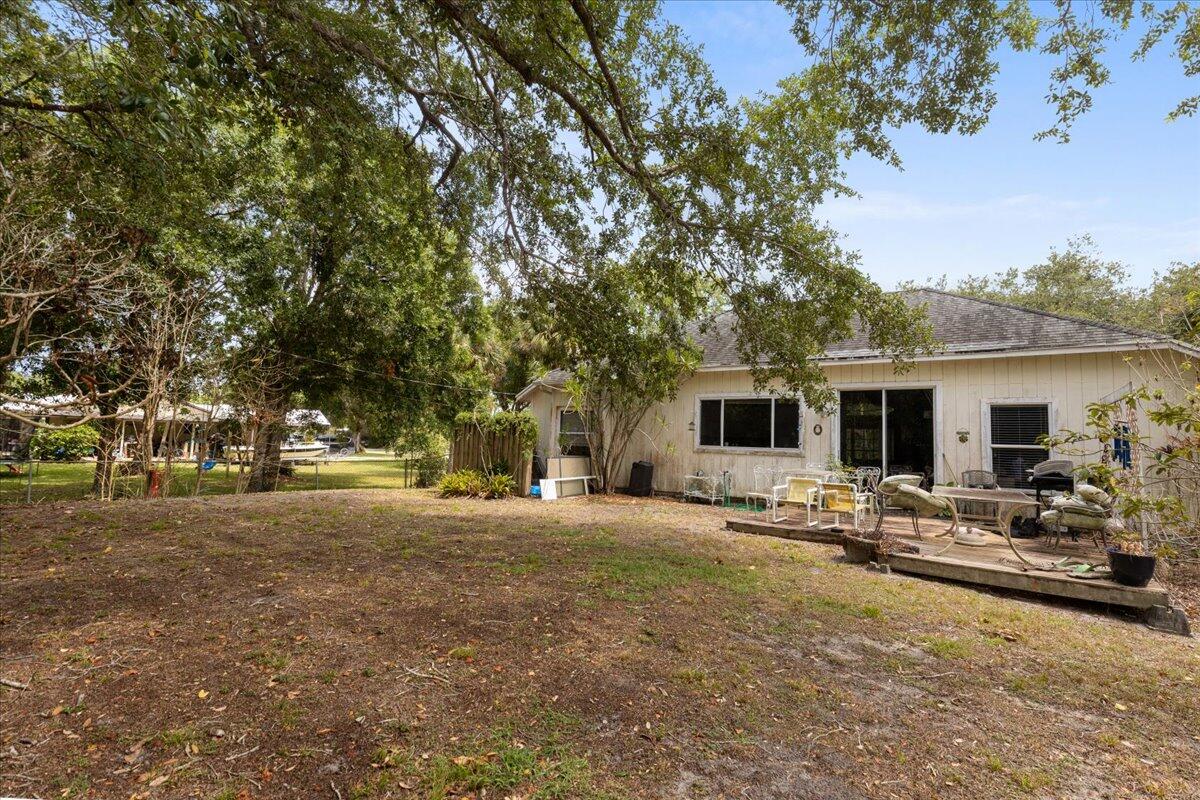 8006 Eden Road Fort Pierce, FL 34951 - Photo 22 of 25 a house with trees in the background