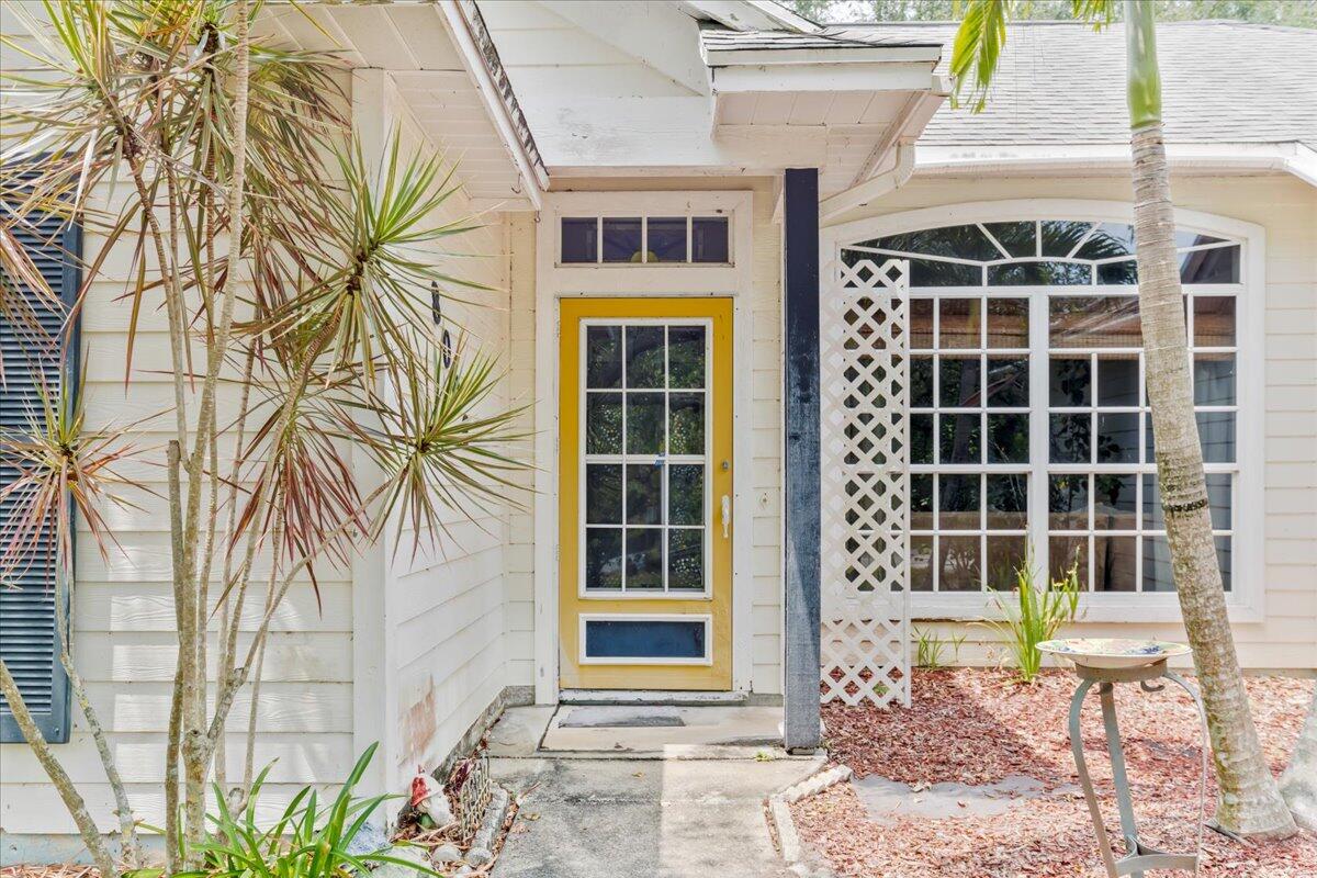 8006 Eden Road Fort Pierce, FL 34951 - Photo 4 of 25 a front view of a house with a large window