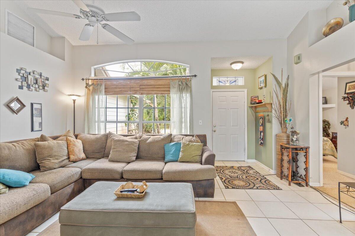 8006 Eden Road Fort Pierce, FL 34951 - Photo 5 of 25 a living room with furniture and a large window