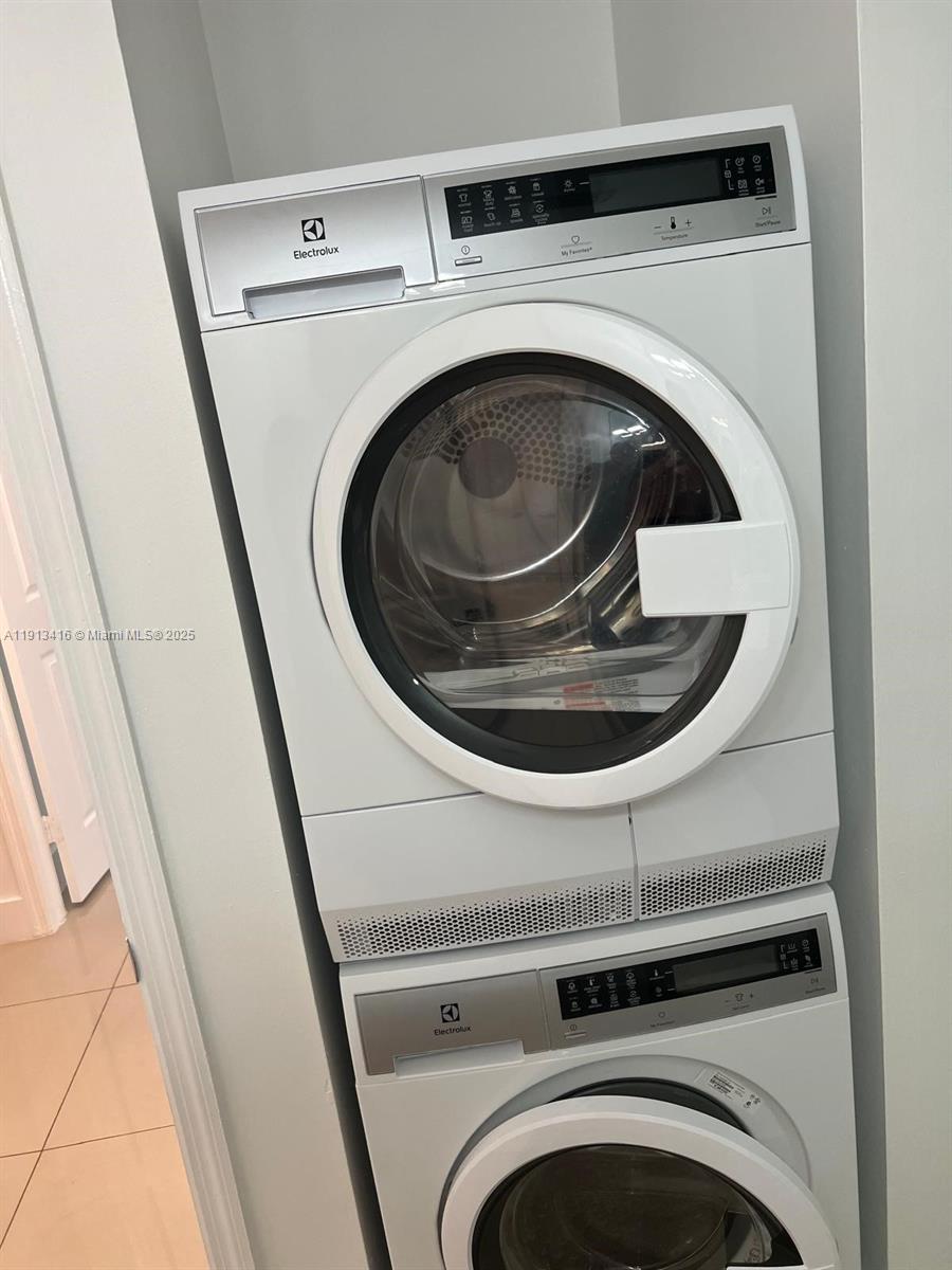 2630 Southwest 28th Street, Unit 40 Miami, FL 33133 - Photo 15 of 16 a utility room with dryer and washer