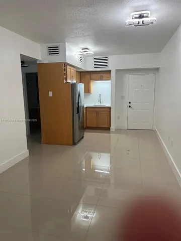 a view of a storage & utility room with a sink