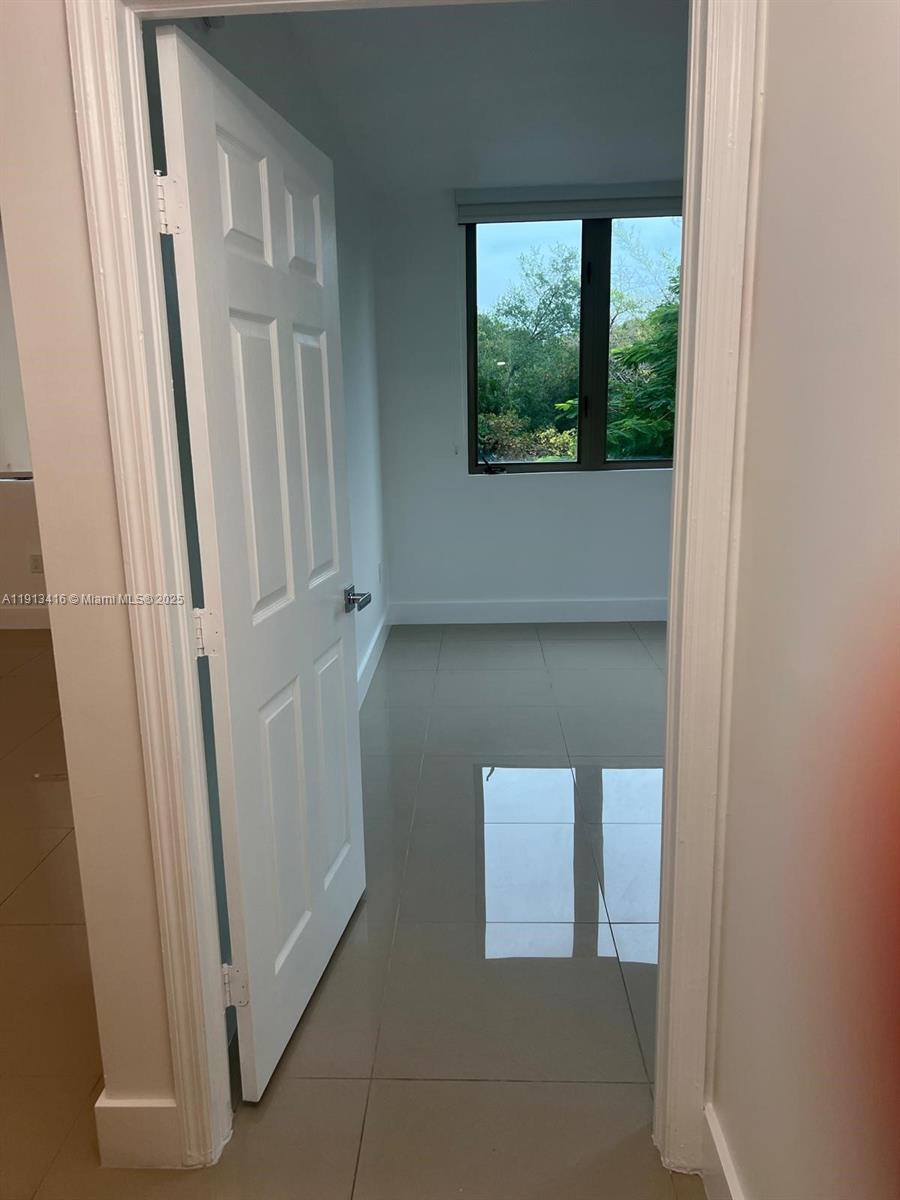 2630 Southwest 28th Street, Unit 40 Miami, FL 33133 - Photo 8 of 16 a view of front door