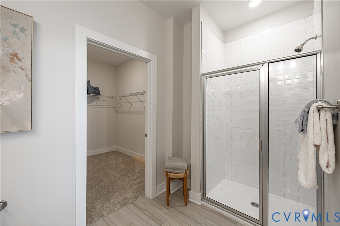 10525 Stony Blf Drive, Unit 204 Ashland, VA 23005 - Photo 27 of 36 a view of bathroom with a glass shower door