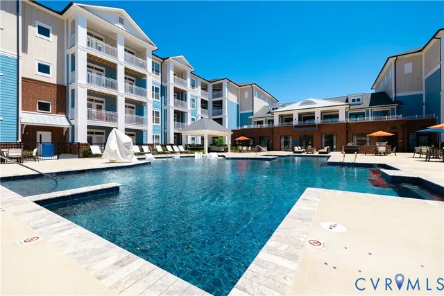 a view of pool with outdoor seating