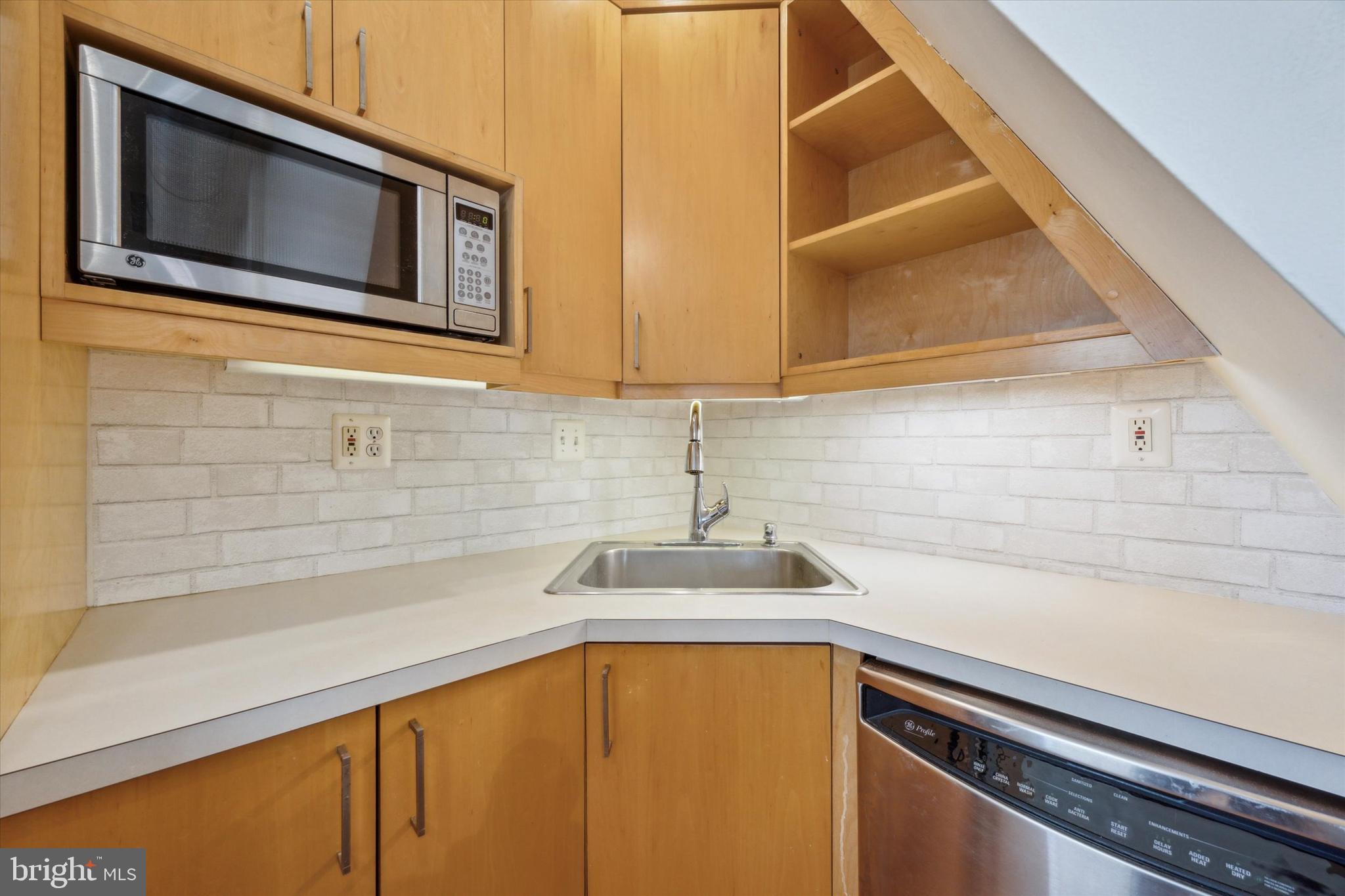 2032 Pine Street, Unit 2 Philadelphia, PA 19103 - Photo 2 of 13 a kitchen with a sink and cabinets