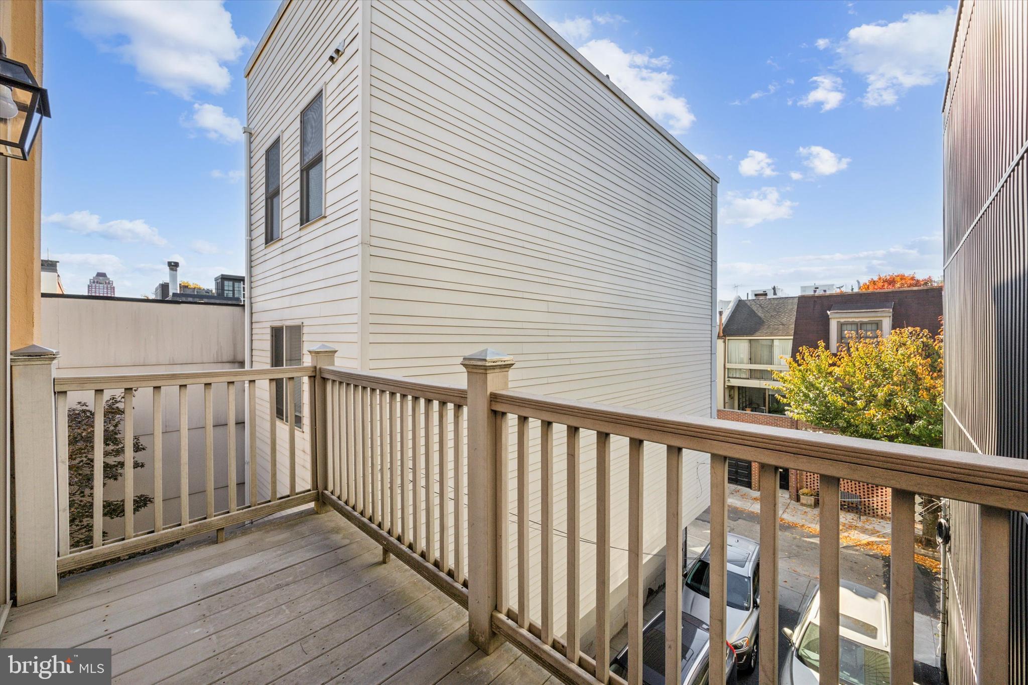 2032 Pine Street, Unit 2 Philadelphia, PA 19103 - Photo 10 of 13 a view of a balcony with wooden floor and fence
