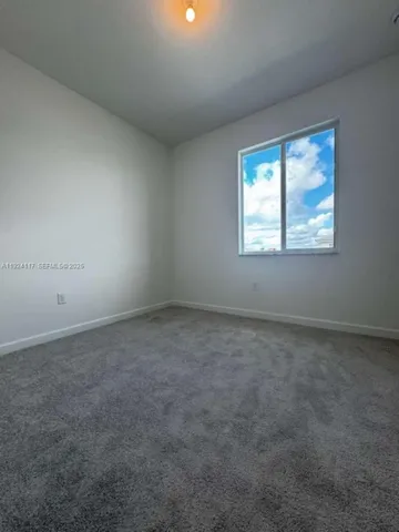 a view of room that has white walls