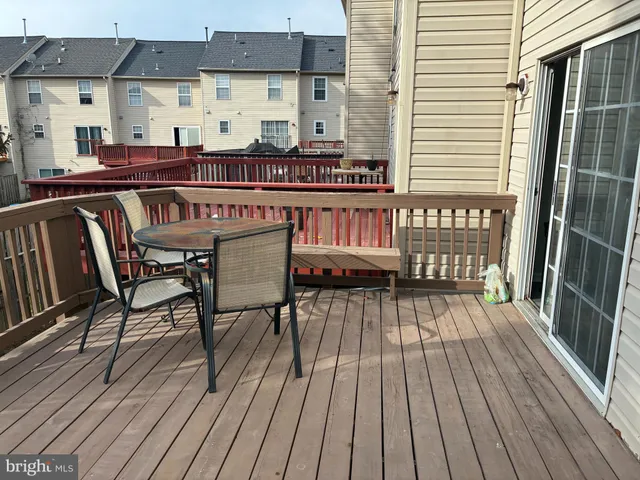 a view of a chairs on wooden deck