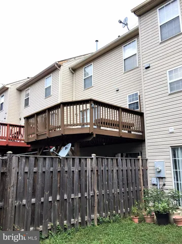 a view of a house with wooden deck