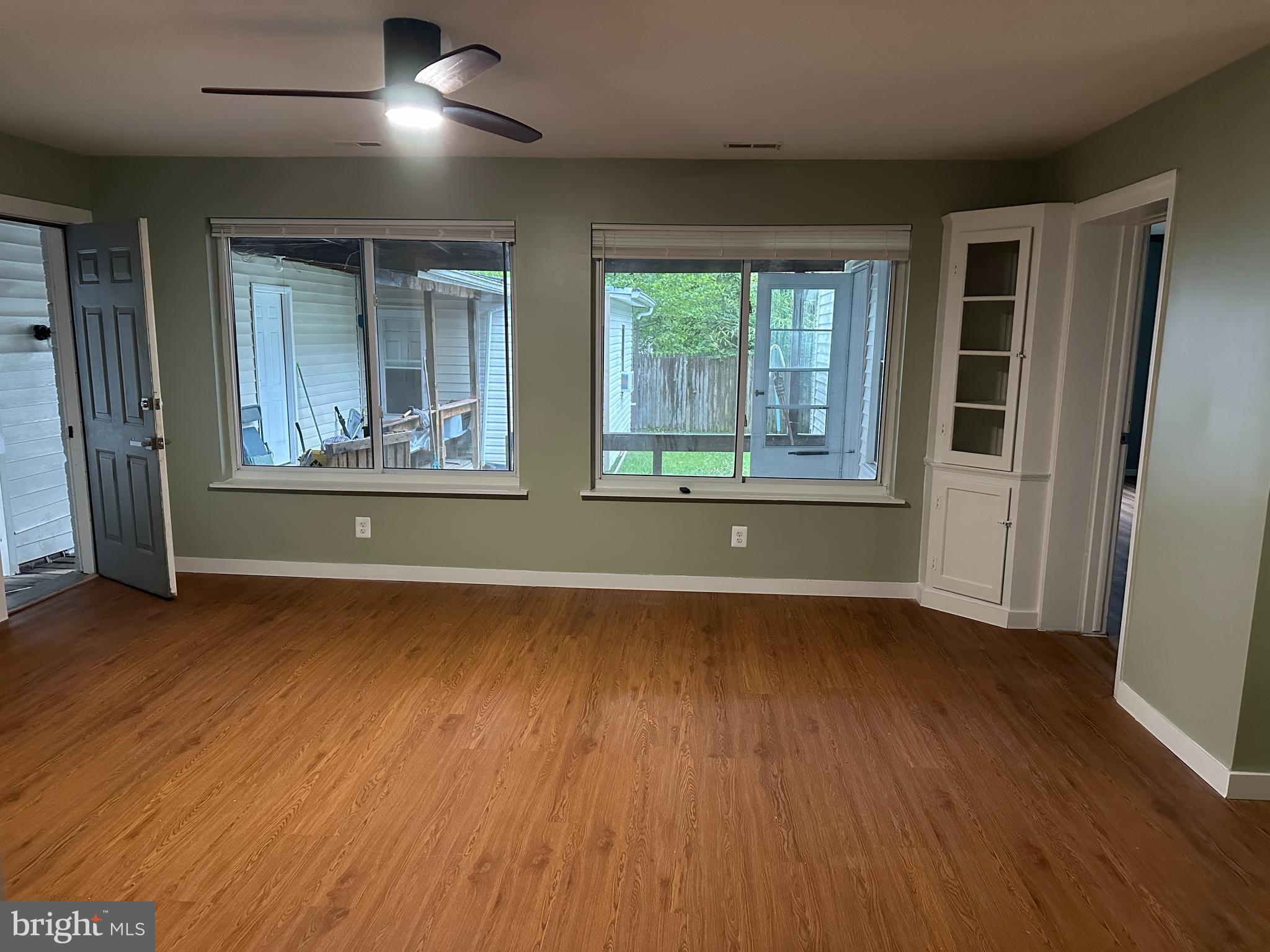 8411 11th Avenue Silver Spring, MD 20903 - Photo 9 of 24 an empty room with wooden floor and windows