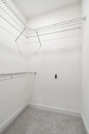 a view of a room with racks on the wall