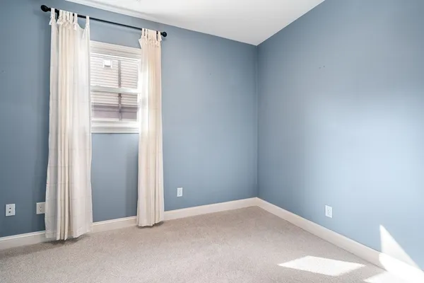 a view of an empty room and closet area