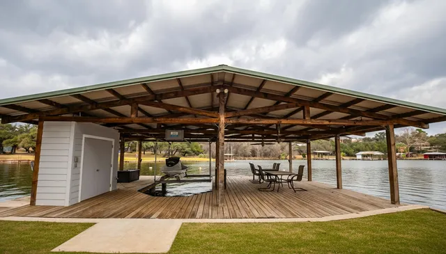 an aerial view of a house with a garden and swimming pool