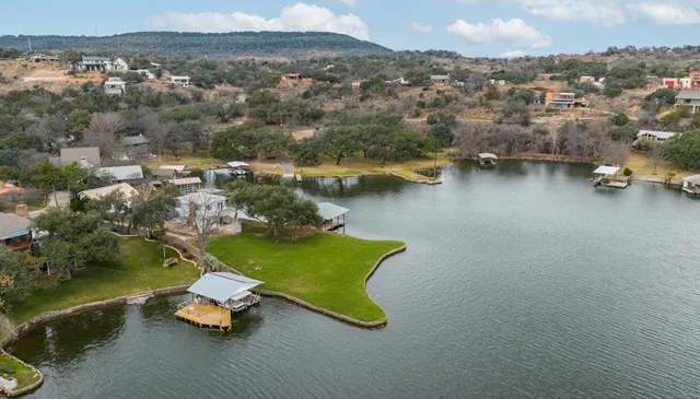 an aerial view of a house with a lake view