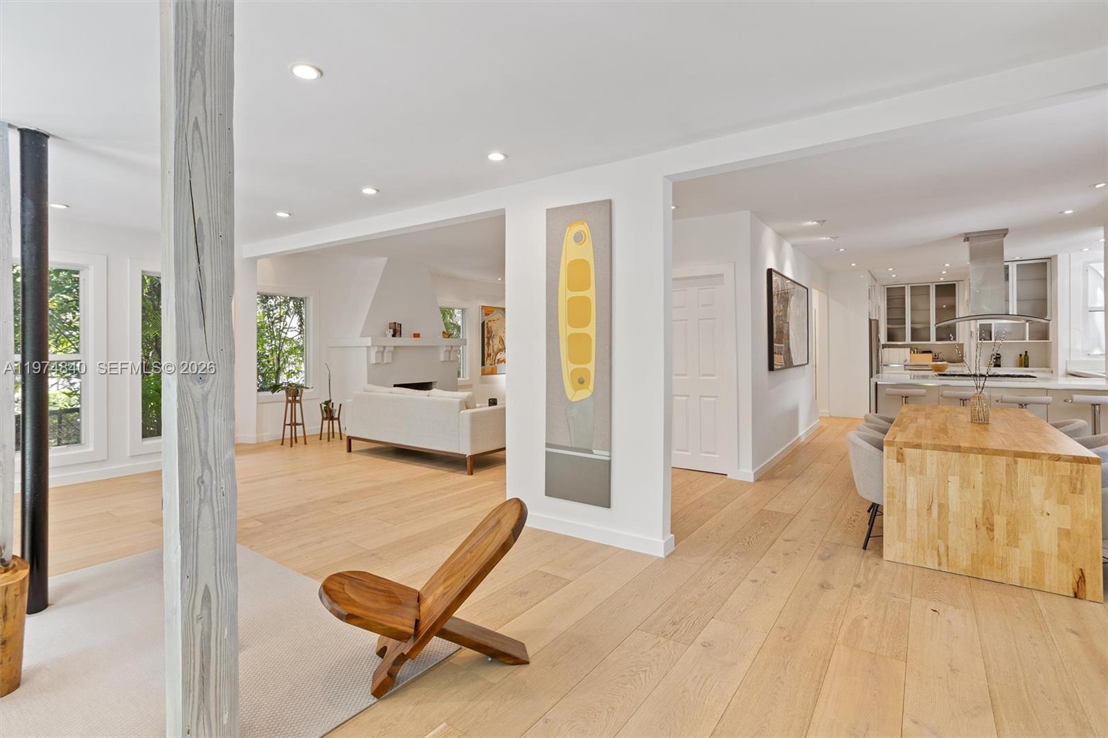 4286 Douglas Road Miami, FL 33133 - Photo 14 of 51 a view of a living room kitchen and a wooden floor