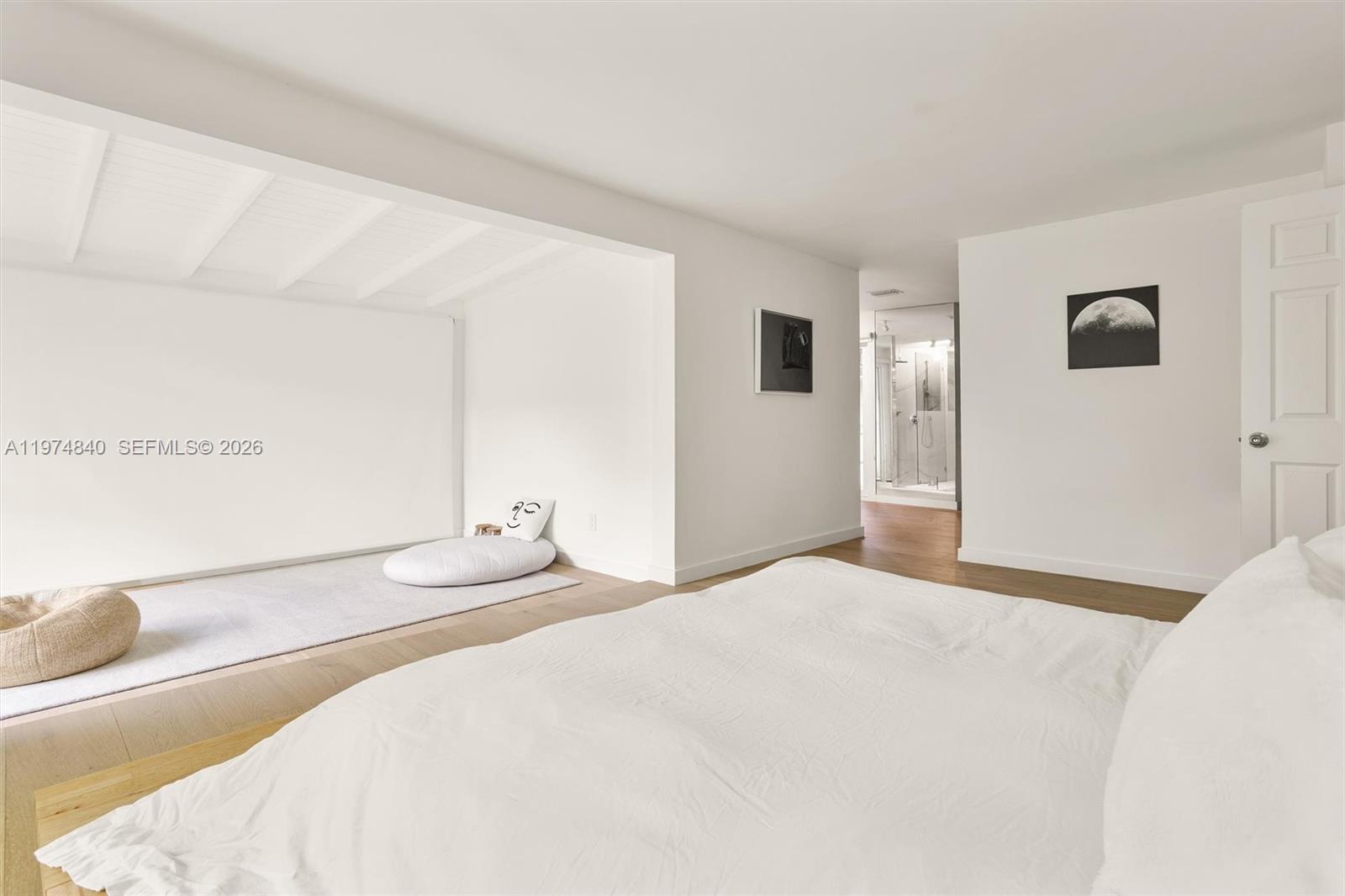 4286 Douglas Road Miami, FL 33133 - Photo 19 of 51 a bedroom with a bed and a cabinets