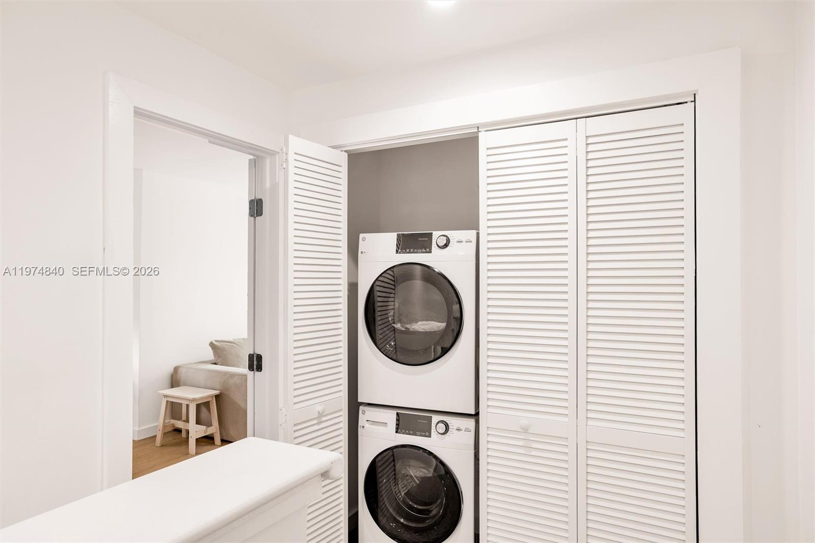 4286 Douglas Road Miami, FL 33133 - Photo 31 of 51 a view of a hallway with washer and dryer