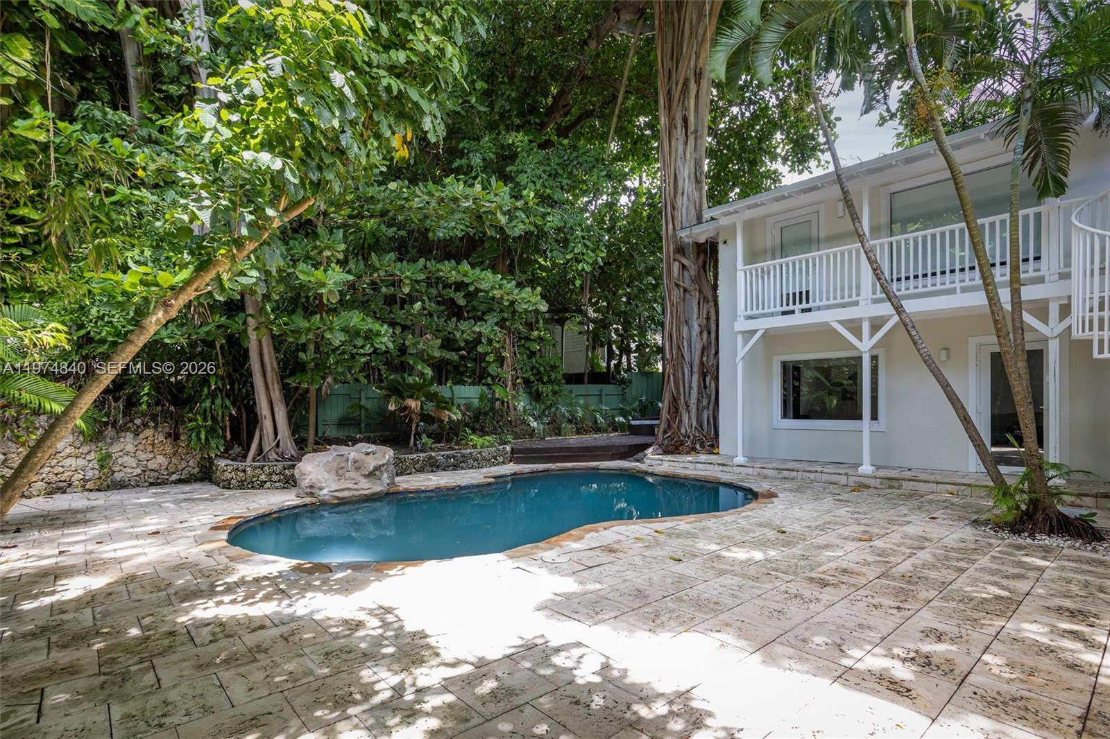 4286 Douglas Road Miami, FL 33133 - Photo 41 of 51 a view of a house with backyard and sitting area