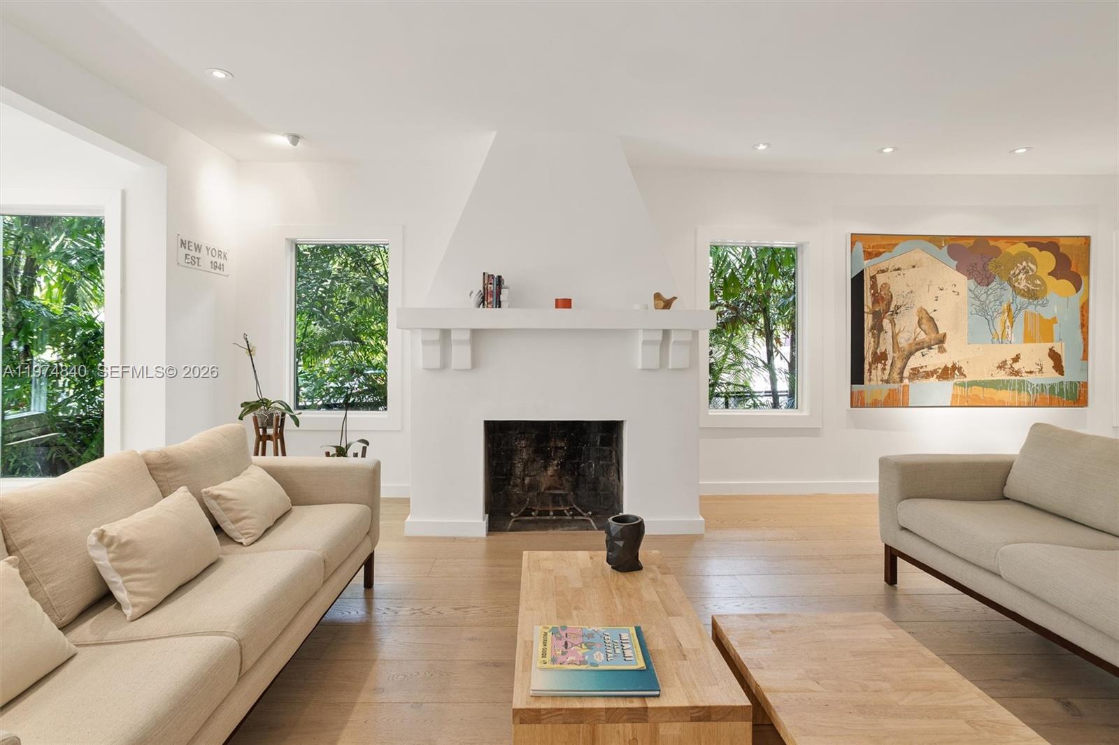 4286 Douglas Road Miami, FL 33133 - Photo 6 of 51 a living room with furniture and a fireplace