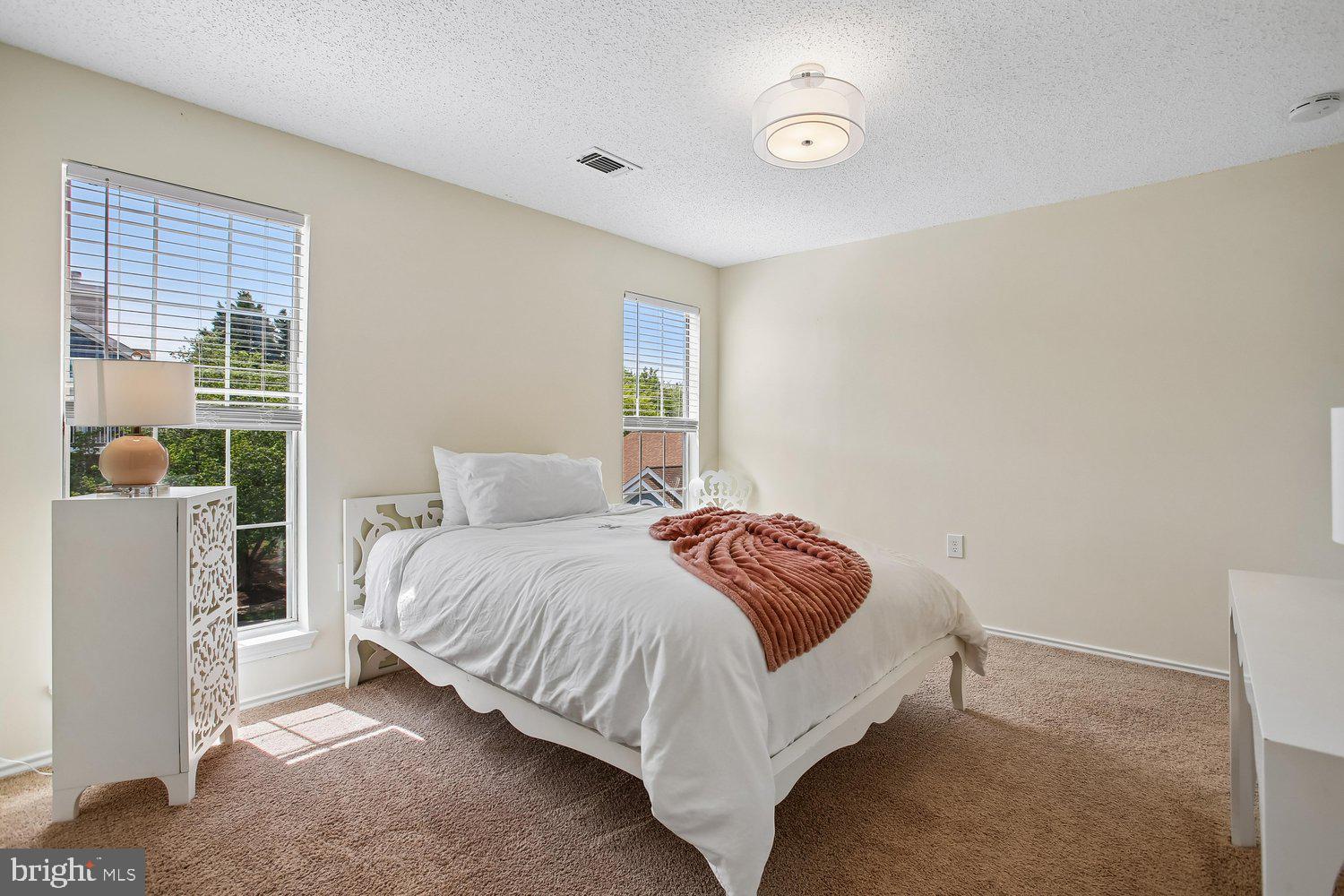 20963 Timber Ridge Terrace, Unit 304 Ashburn, VA 20147 - Photo 14 of 42 Primary Bedroom
