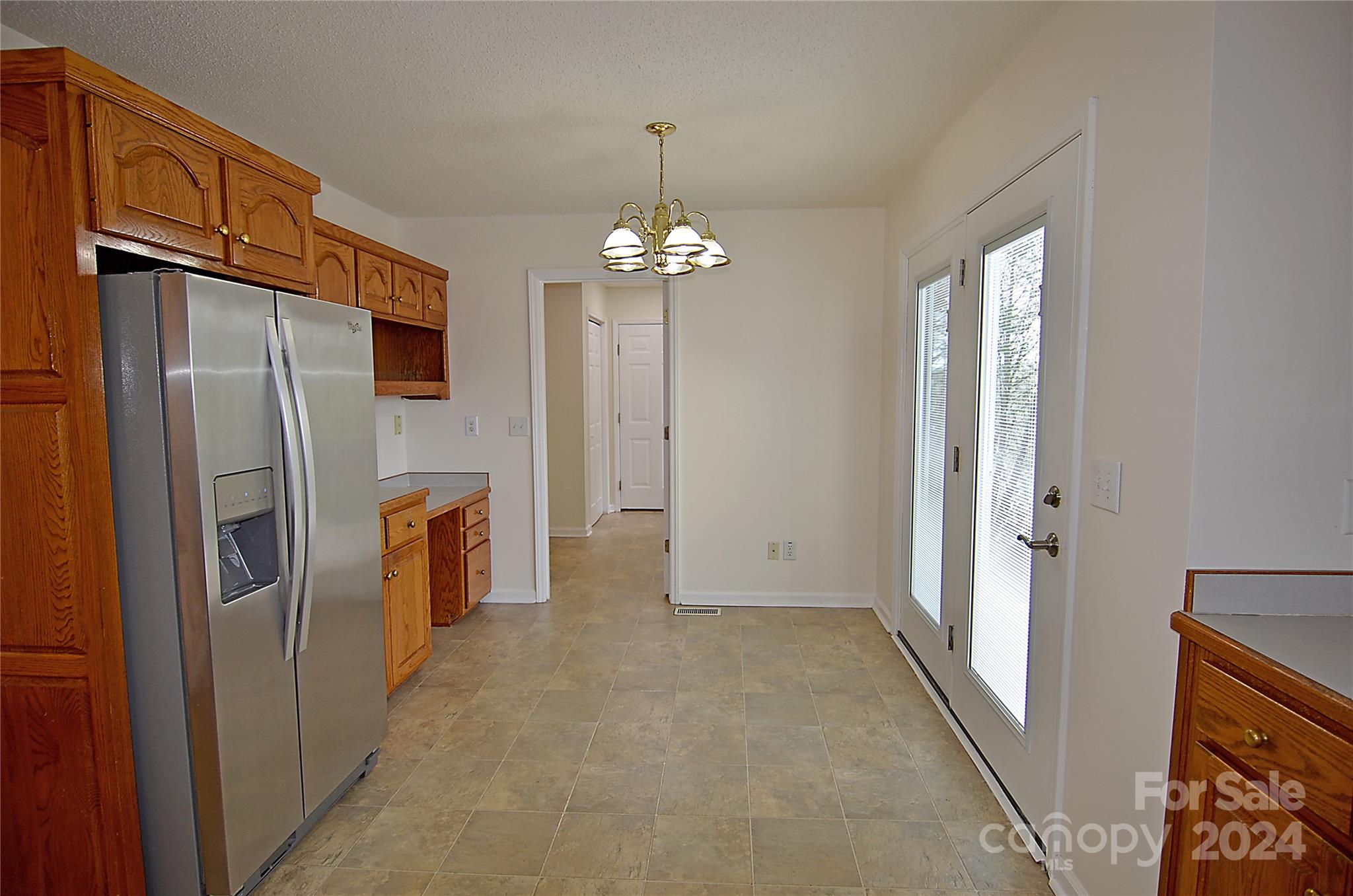 322 Cobblestone Drive Marion, NC 28752 - Photo 12 of 26 a kitchen with stainless steel appliances granite countertop a refrigerator a sink and dishwasher