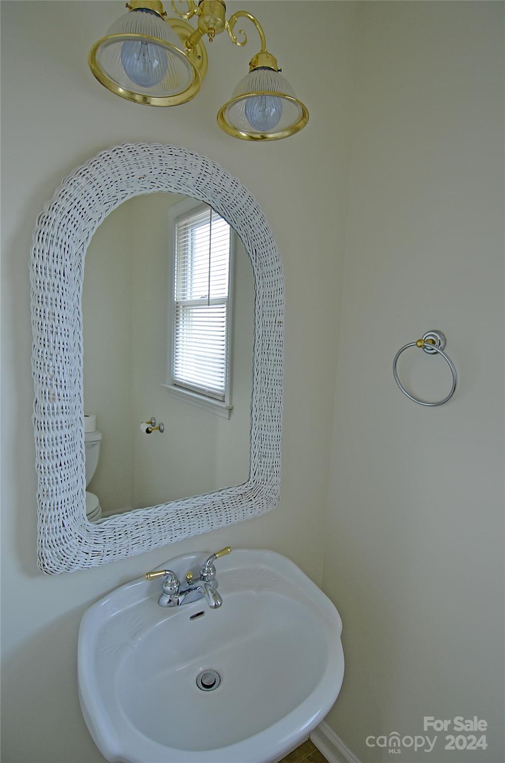 322 Cobblestone Drive Marion, NC 28752 - Photo 14 of 26 a bathroom with a sink and mirror