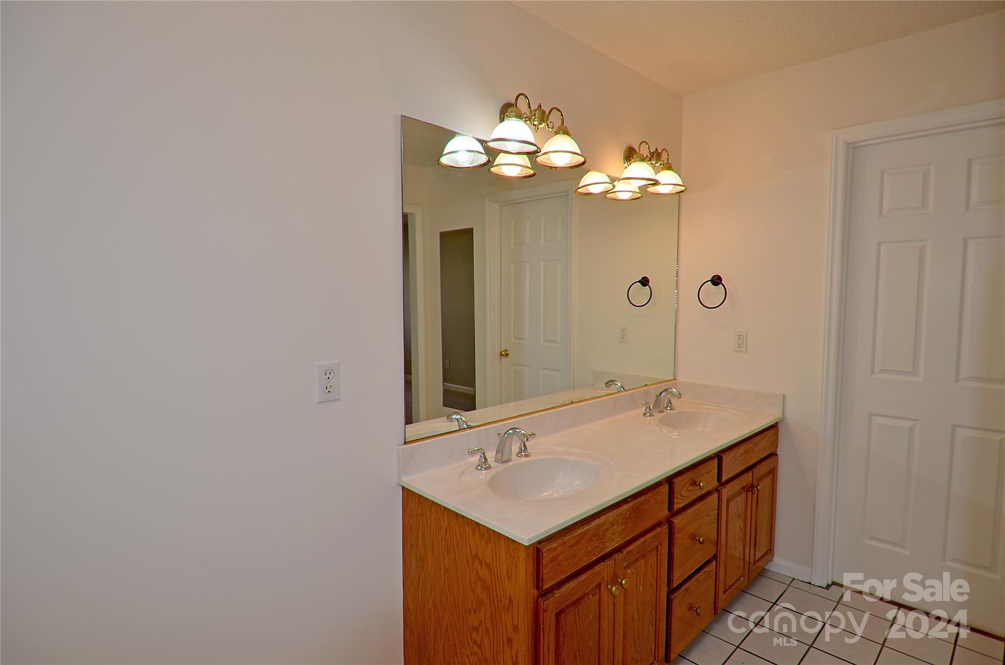 322 Cobblestone Drive Marion, NC 28752 - Photo 18 of 26 a bathroom with a sink and a mirror