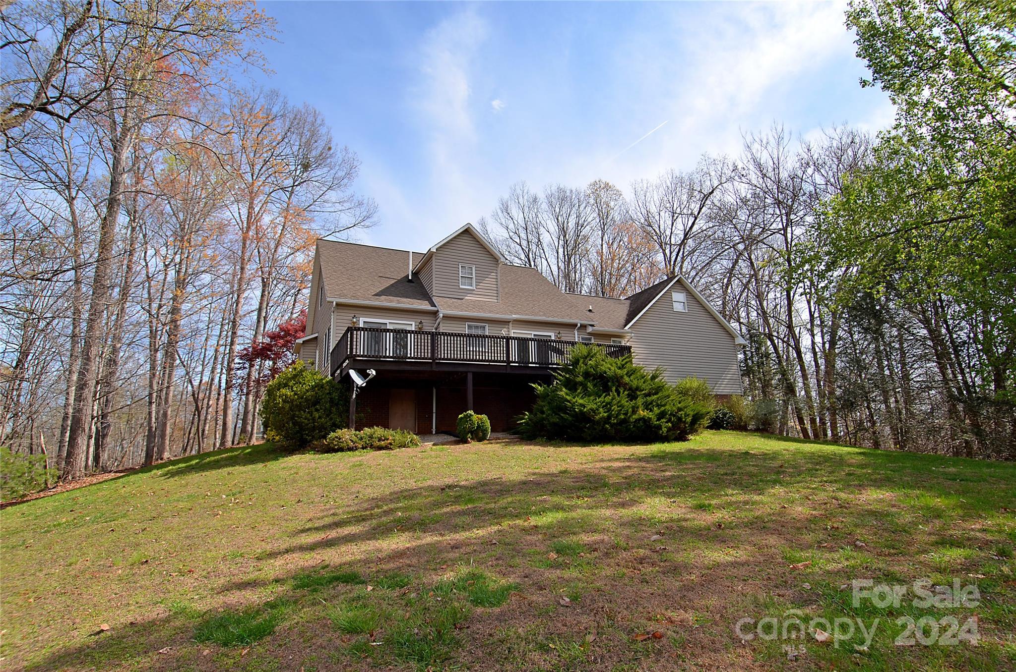 322 Cobblestone Drive Marion, NC 28752 - Photo 6 of 26 a view of a house with a yard covered with snow