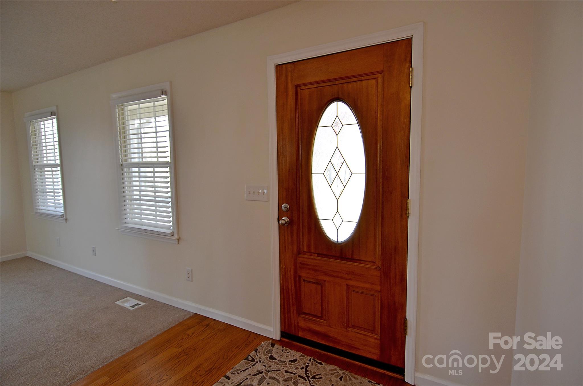 322 Cobblestone Drive Marion, NC 28752 - Photo 8 of 26 a view of a hallway with wooden floor