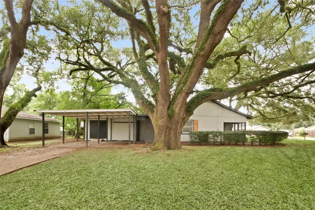 a house view with a garden space