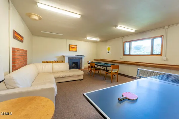 a living room with furniture and a table