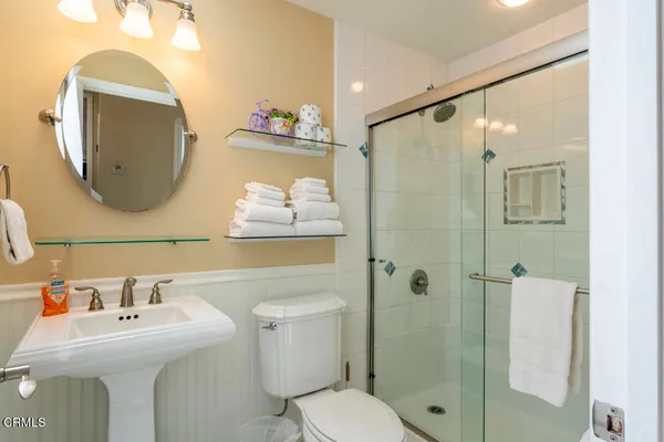 a bathroom with a sink toilet and shower