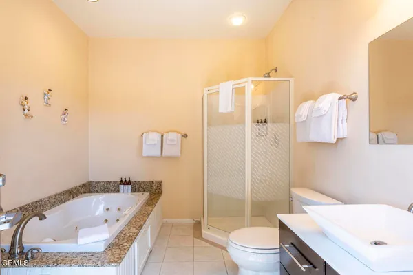 a bathroom with a tub toilet and sink