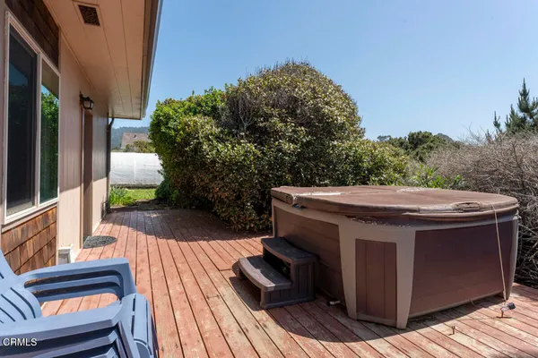 a view of a patio with wooden floor