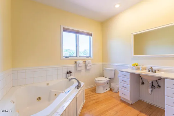 a bathroom with a sink a toilet and bathtub