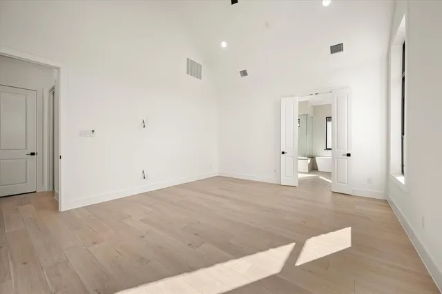 a bathroom with a granite countertop sink mirror and bathtub