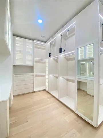 a room with a sink and cabinets