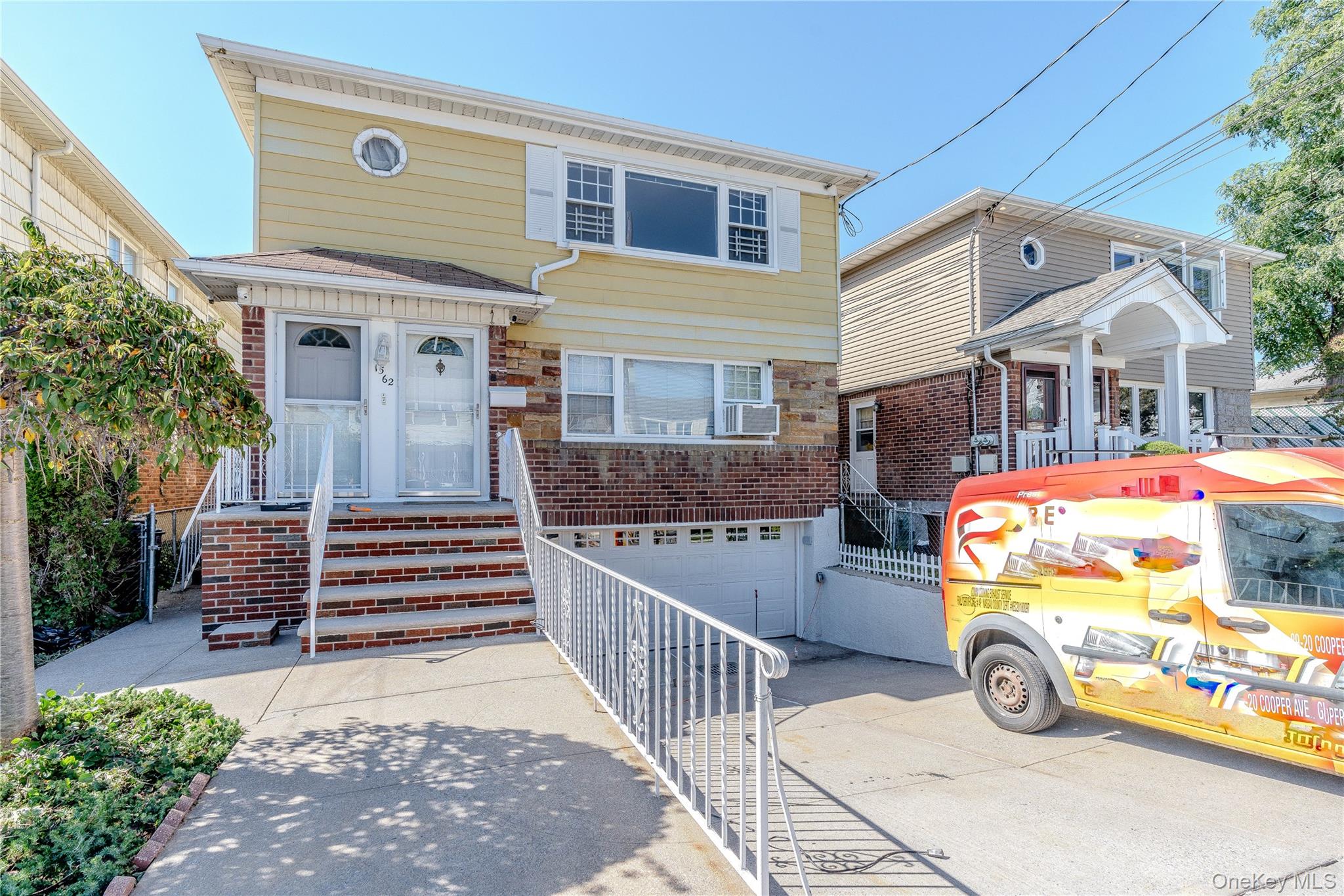 a front view of house with parking space