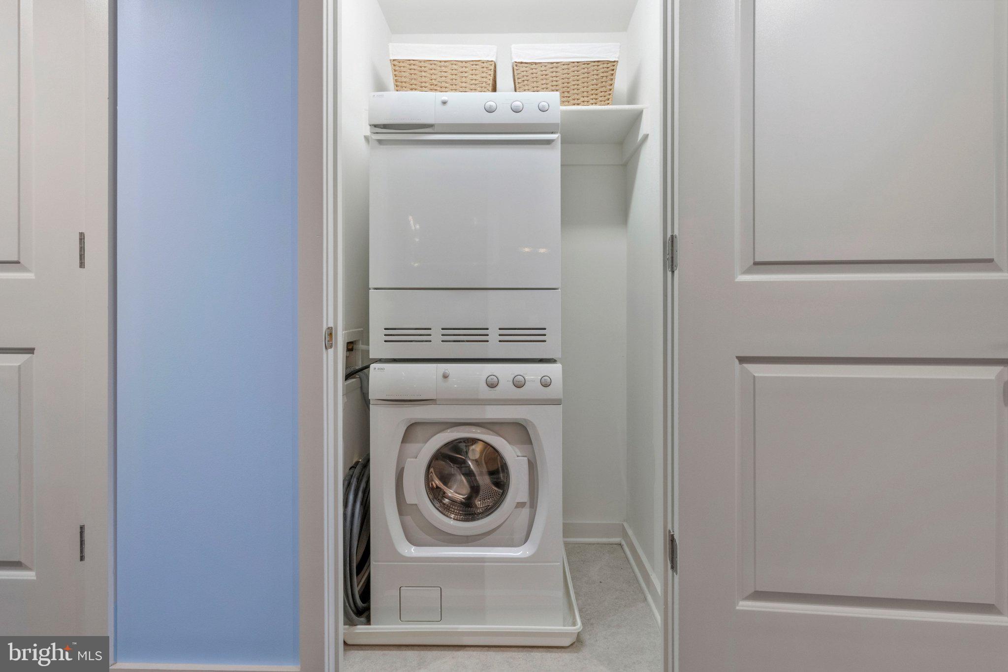 1025 First Street Southeast, Unit 907 Washington, DC 20003 - Photo 12 of 22 a utility room with dryer and washer