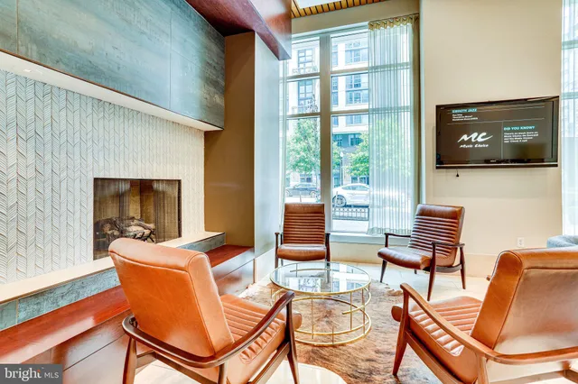 a outdoor living space with patio furniture and a flat screen tv