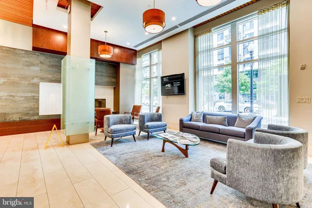 a living room with furniture and a large window