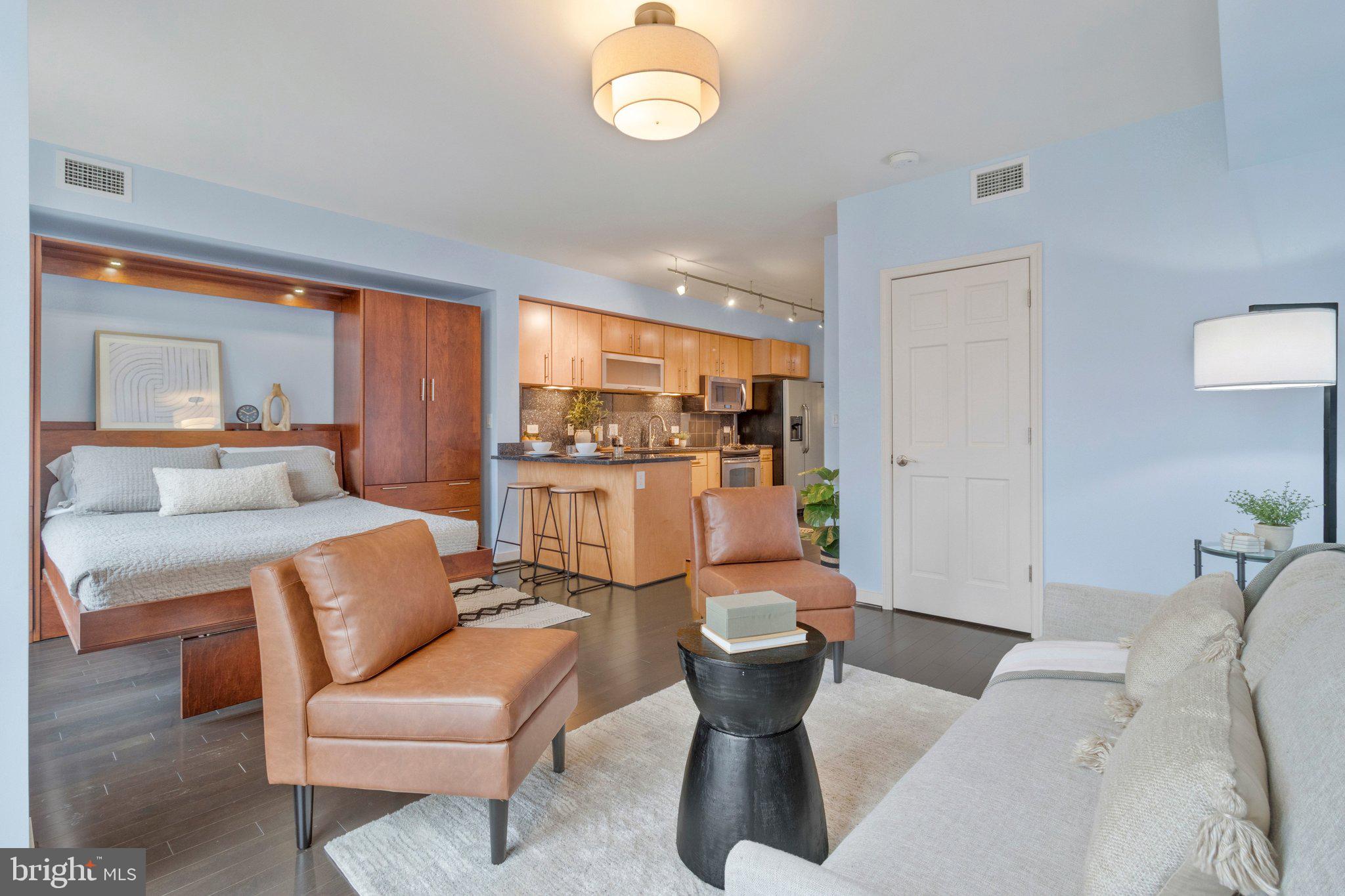 1025 First Street Southeast, Unit 907 Washington, DC 20003 - Photo 5 of 22 a living room with furniture a rug and a large window