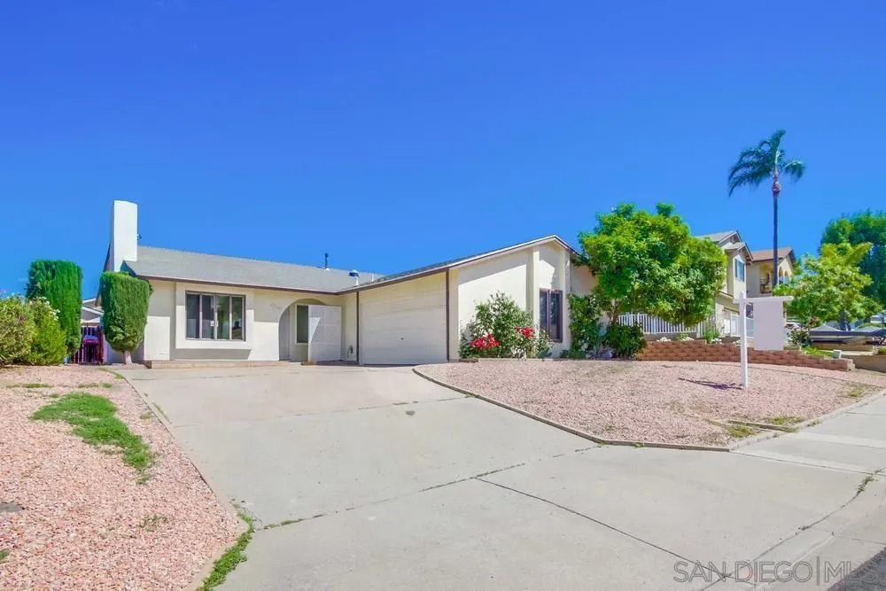 12941 Standish Drive Poway, CA 92064 - Photo 1 of 30 a front view of a house with a yard and a garage