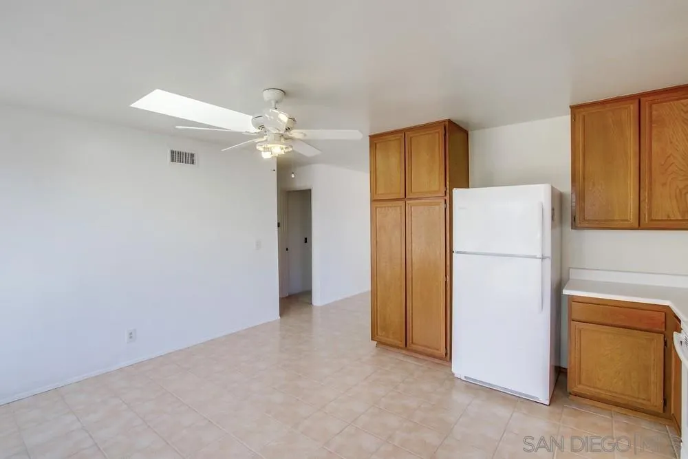 12941 Standish Drive Poway, CA 92064 - Photo 13 of 30 a view of a kitchen with refrigerator and cabinet
