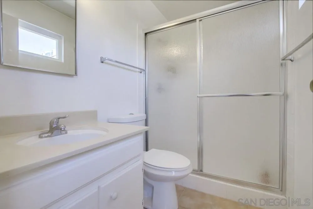 12941 Standish Drive Poway, CA 92064 - Photo 25 of 30 a bathroom with a sink toilet and shower