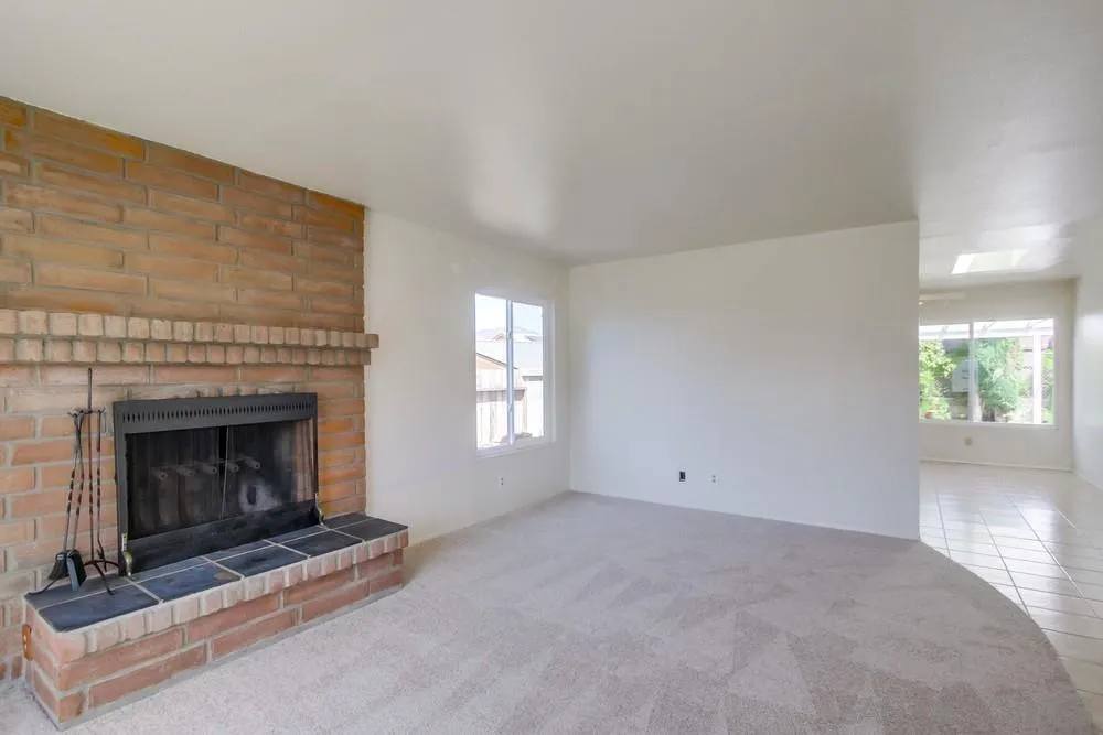 12941 Standish Drive Poway, CA 92064 - Photo 7 of 30 a view of empty room with a fireplace