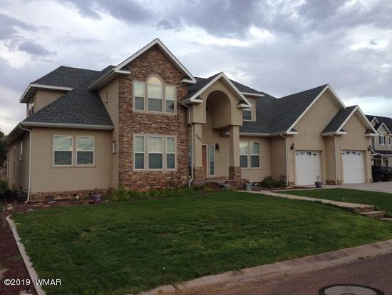 1362 Lobo Trail Snowflake, AZ 85937 - Photo 1 of 34 a front view of a house with a garden