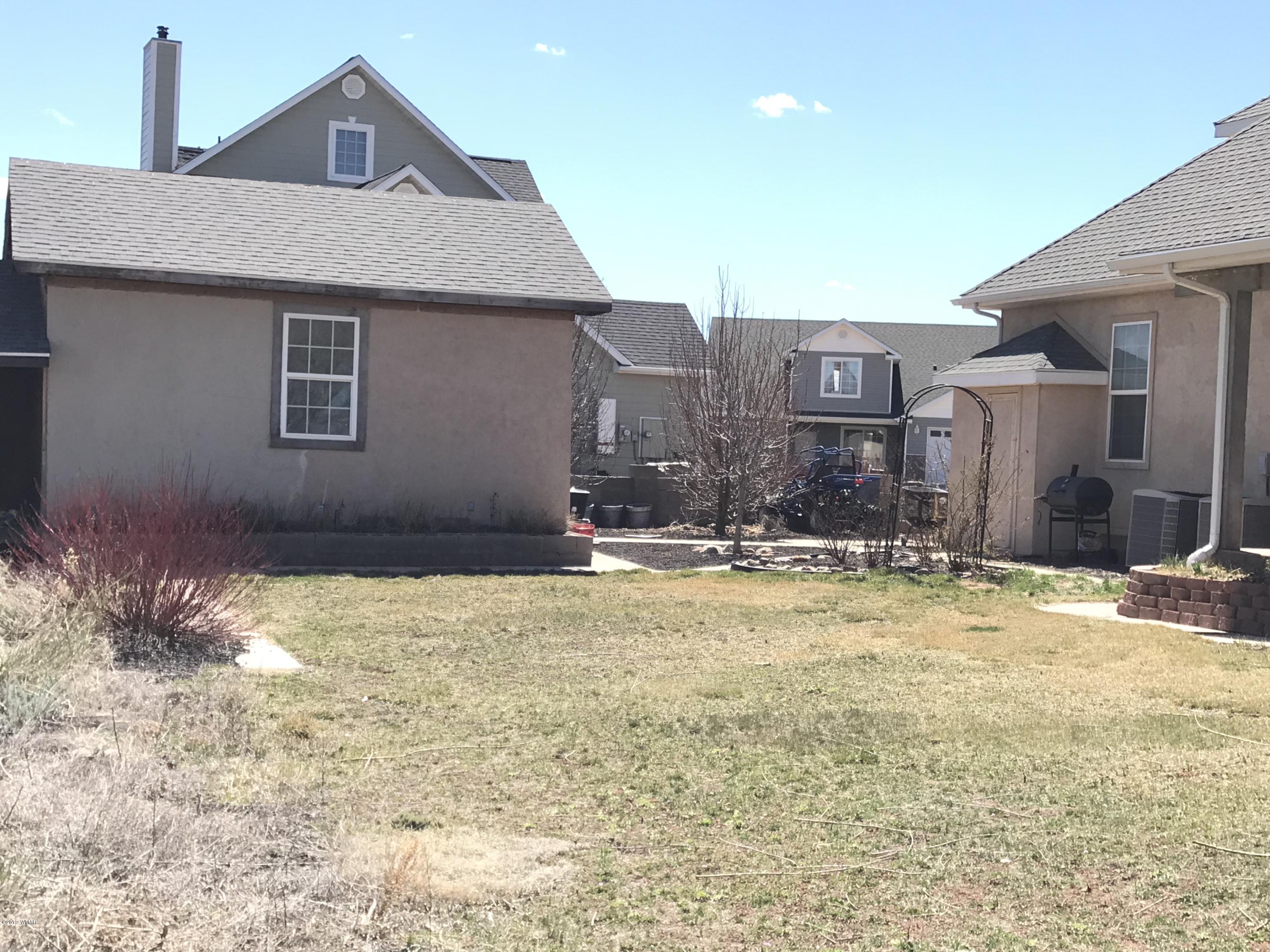 1362 Lobo Trail Snowflake, AZ 85937 - Photo 31 of 34 a view of a house with a yard