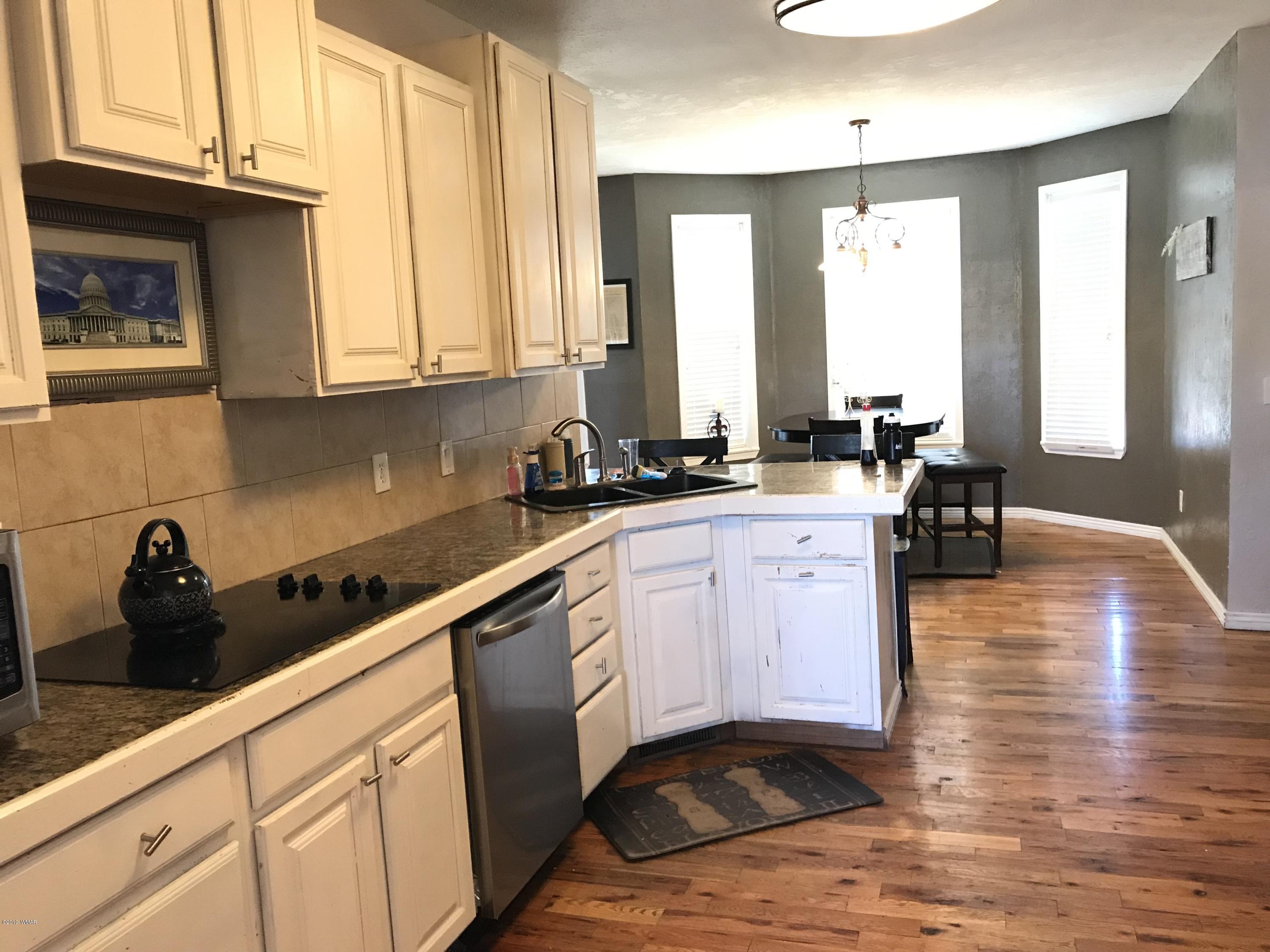 1362 Lobo Trail Snowflake, AZ 85937 - Photo 8 of 34 a kitchen with stainless steel appliances granite countertop a sink a stove and cabinets